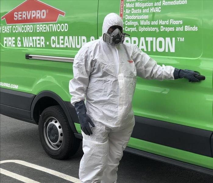 Man in a white tyvek suit